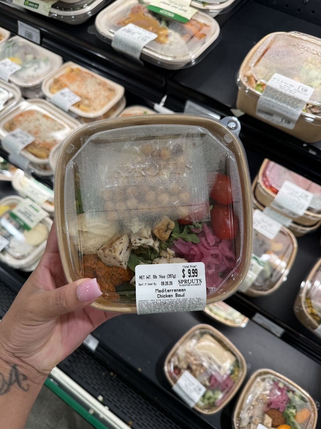 Sprouts Mediterranean Chicken Bowl with chickpeas, hummus, arugula and pickled onion, priced at $9.99