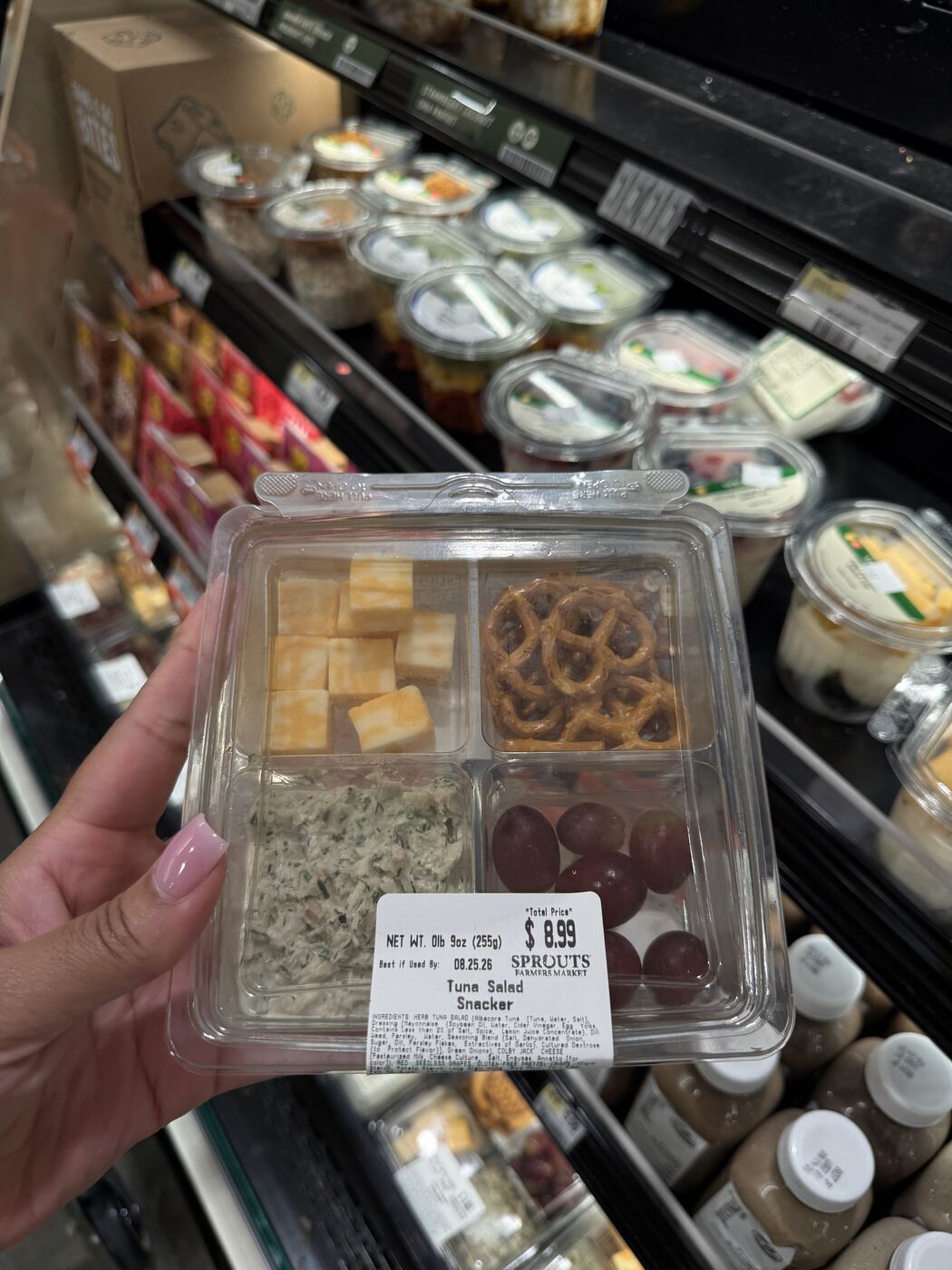 Sprouts Tuna Salad Snacker with pretzels, grapes, cheese and tuna, priced at $8.99
