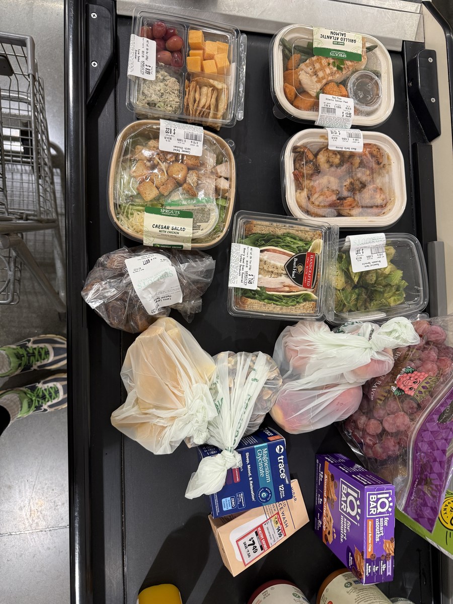 Prepped meals from Sprouts: grilled salmon, garlic shrimp, caesar salad, turkey sandwich, and snack trays